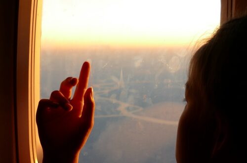 girl, hand, airplane window-878936.jpg