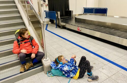 waiting for baggage at airport with kids