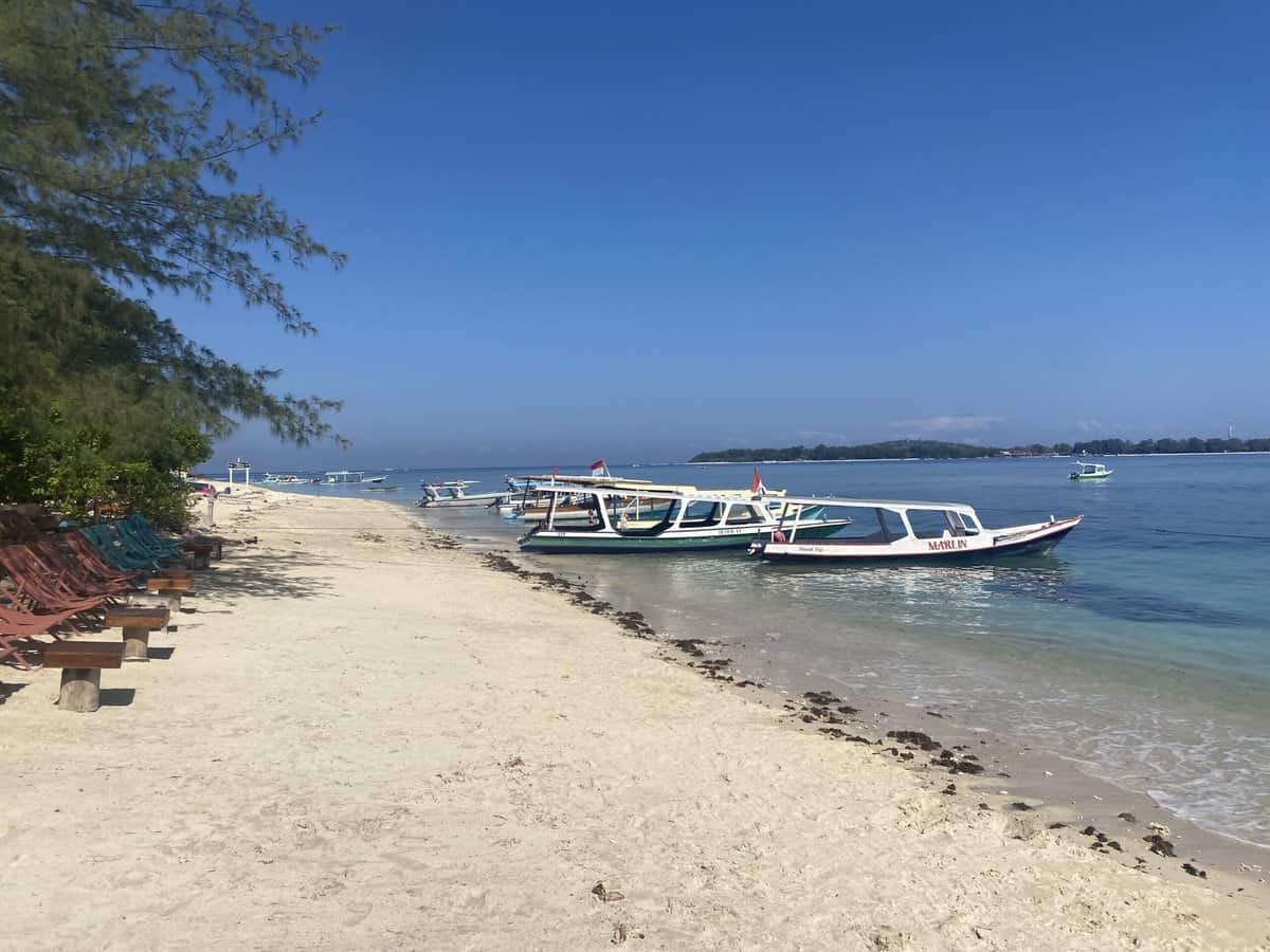 local boats take families out to snorkel in the Gili islands Lombok